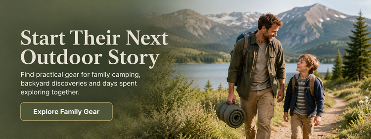 Outdoor lifestyle advertisement featuring a father and son hiking along a mountain path with a lake in the background. The left side has a dark green overlay with the text 'Start Their Next Outdoor Story' and a 'Explore Family Gear' button.